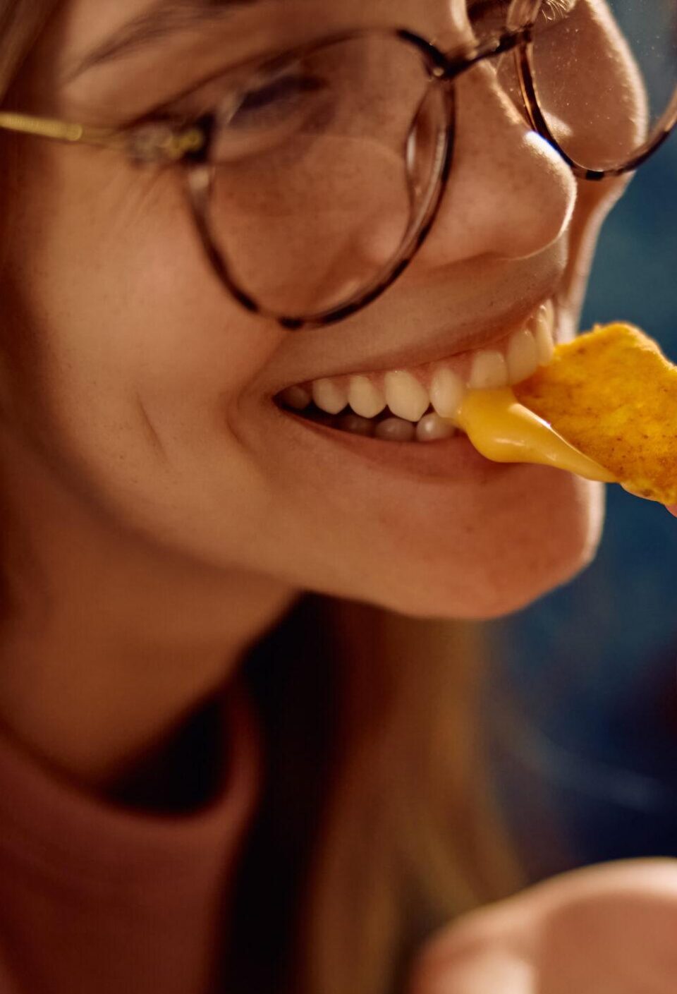 Close up of nachos with cheese during home party with friends. Close up of nachos with cheese during home party with friends.