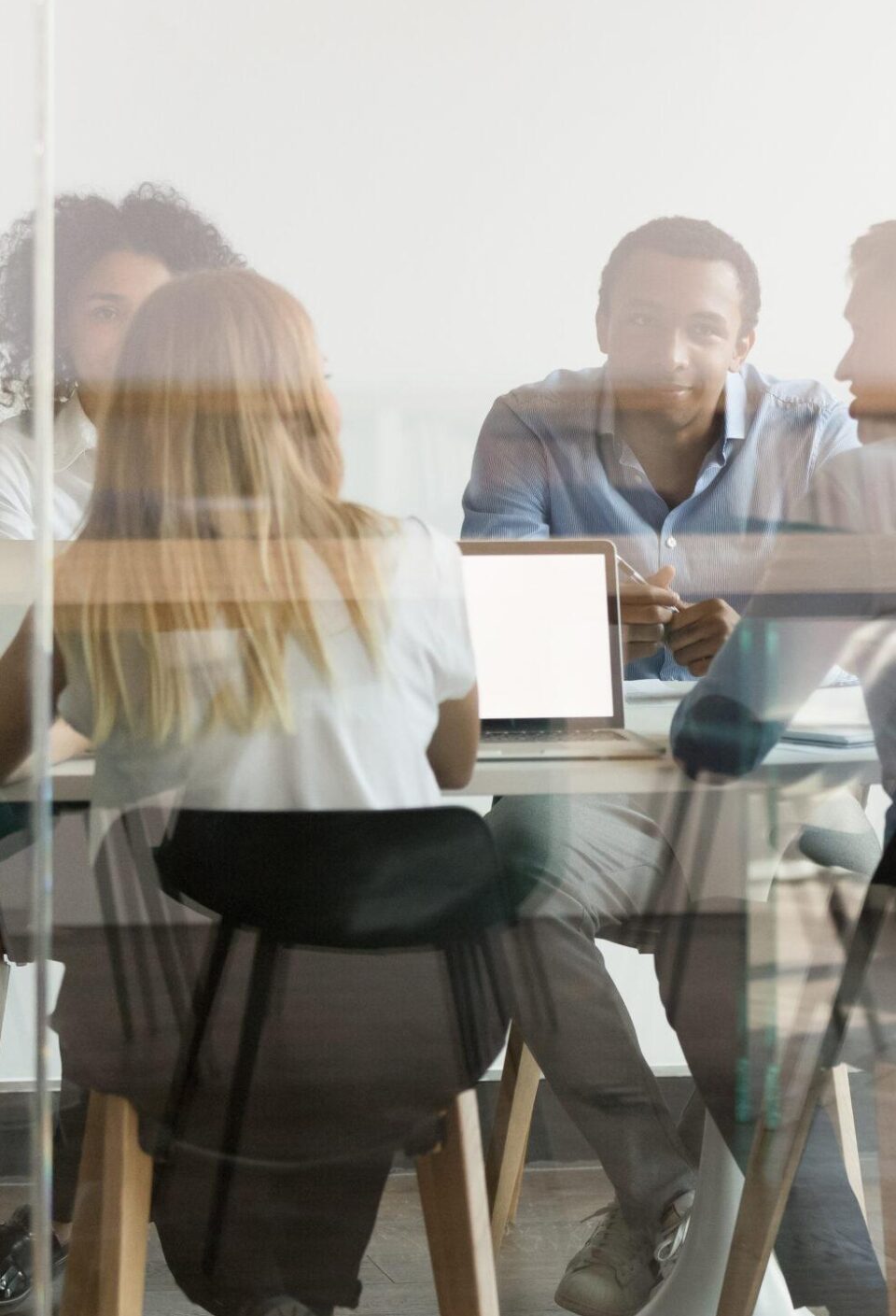Multiethnic employee brainstorm discuss ideas together in boardroom Multiethnic employee brainstorm discuss ideas together in boardroom
